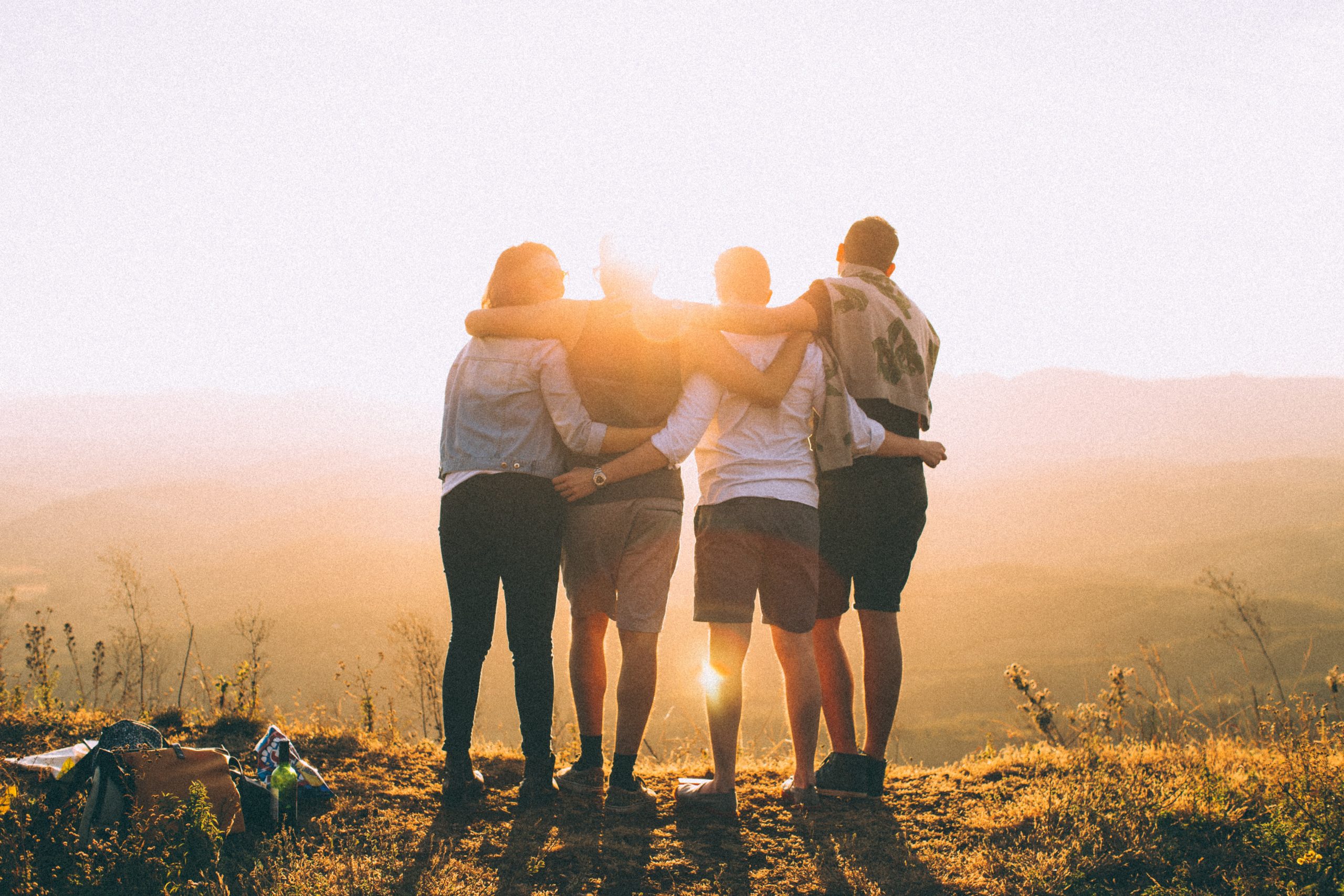 young people hugging eachother